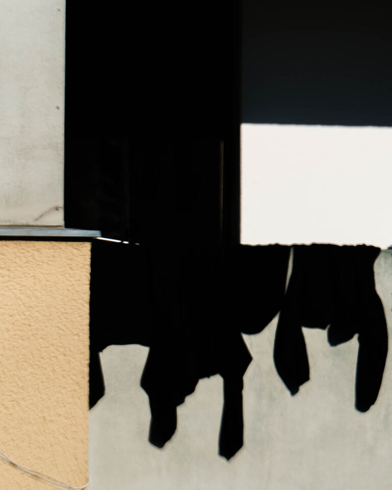 Black and white building edge with hard shadow, Berlin