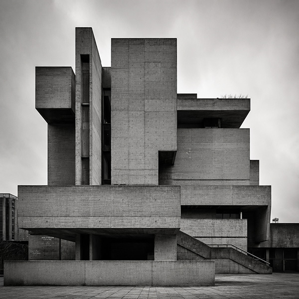 Brutalist architecture in black and white — raw concrete forms in light and shadow