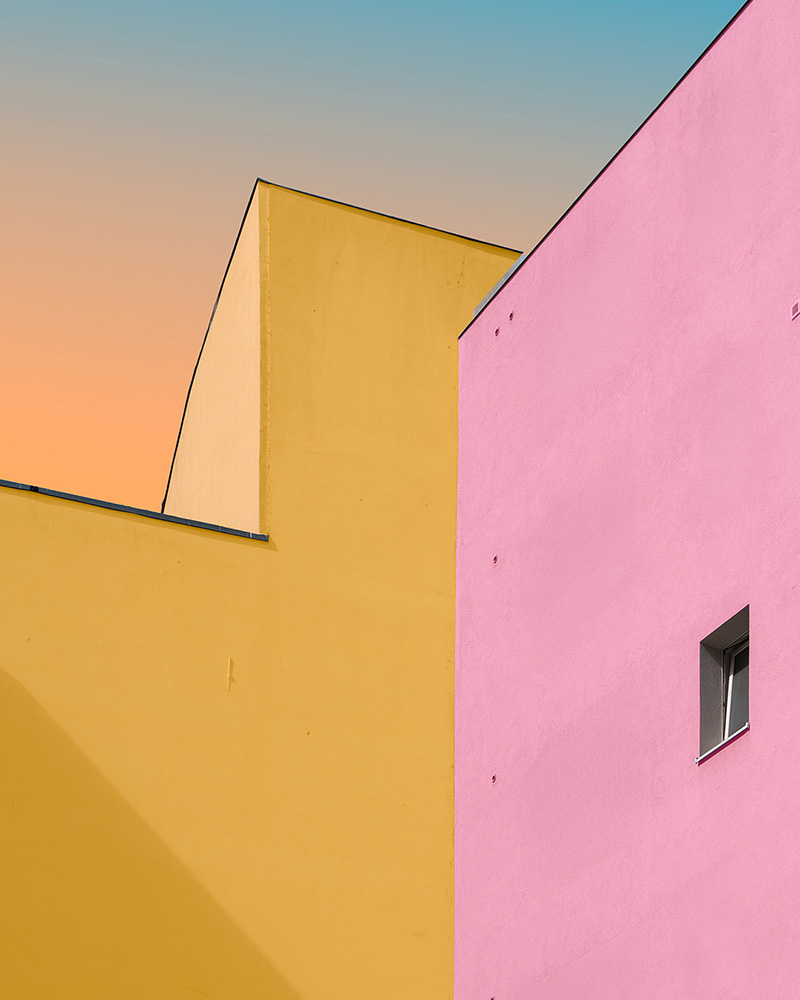 Colour-shifted pink and yellow façades beneath a gradient sky, Berlin